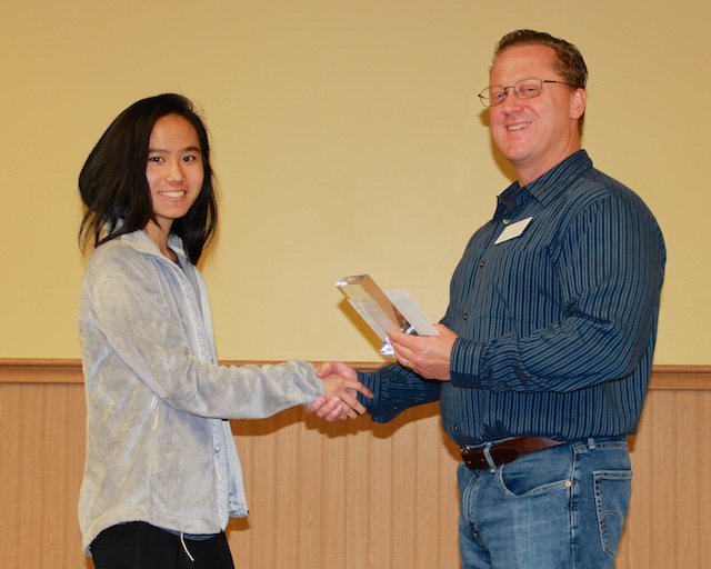 Student receiving award